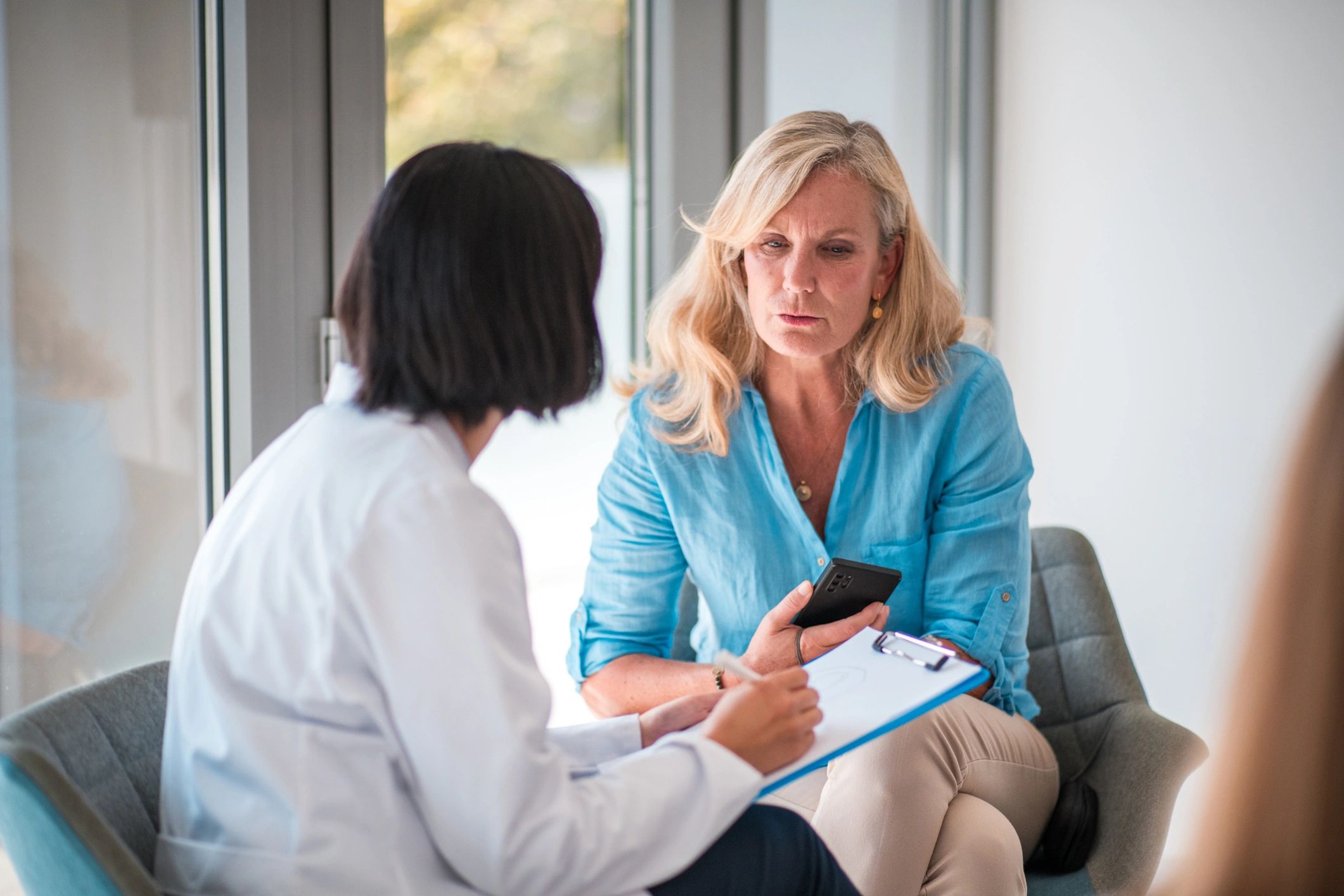 Experienced naturopathic doctors consulting with a patient